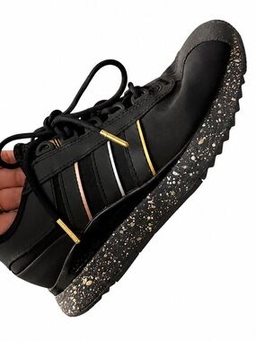 Adidas Sneaker with Gold Accents and Speckled Sole